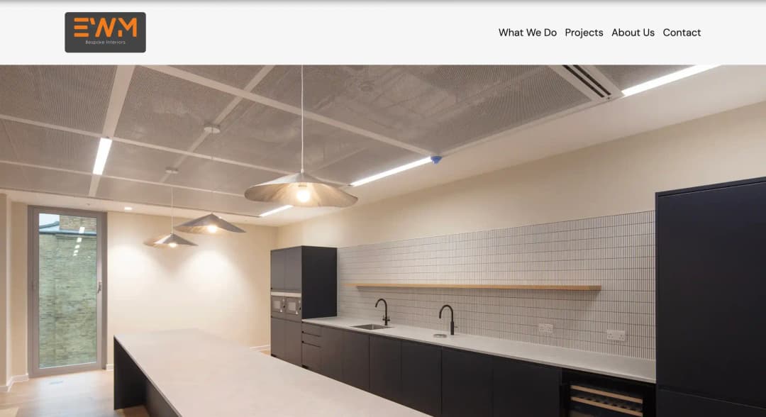 A screenshot of the EWM site showcasing the home page, which features a hero section with an image carousel.
